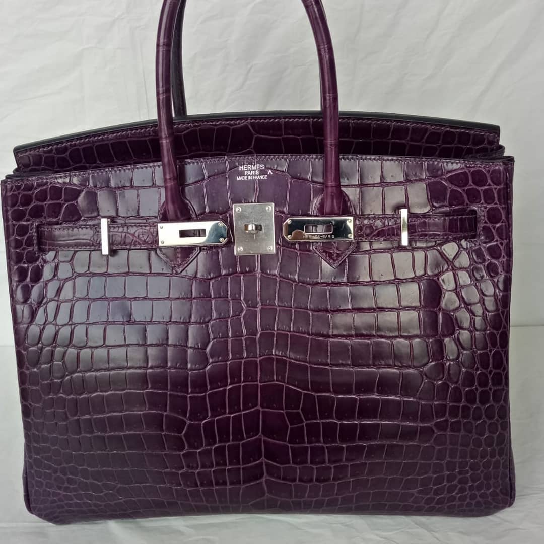 Shiny purple porosus crocodile and palladium hardware handbag