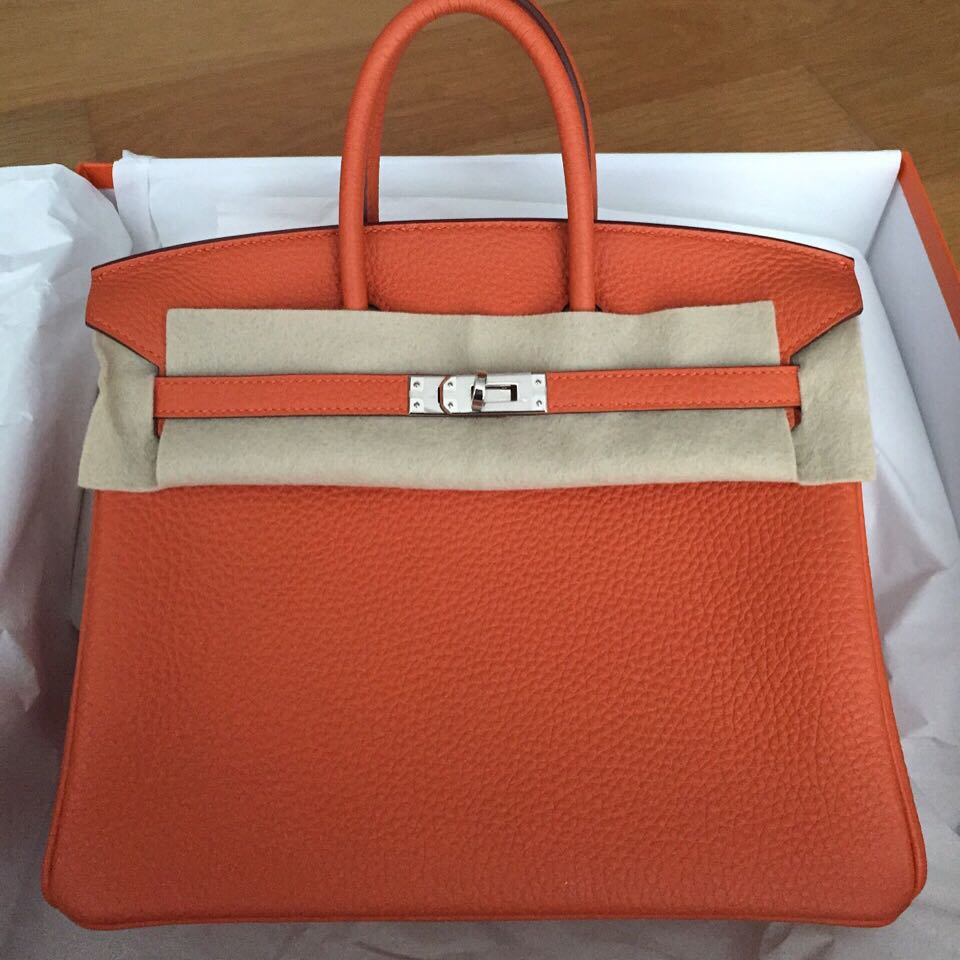 Sold at Auction: HERMÈS, AN ICONIC HERMÈS ORANGE BIRKIN 25 WITH SILVER  PALLADIUM HARDWARE