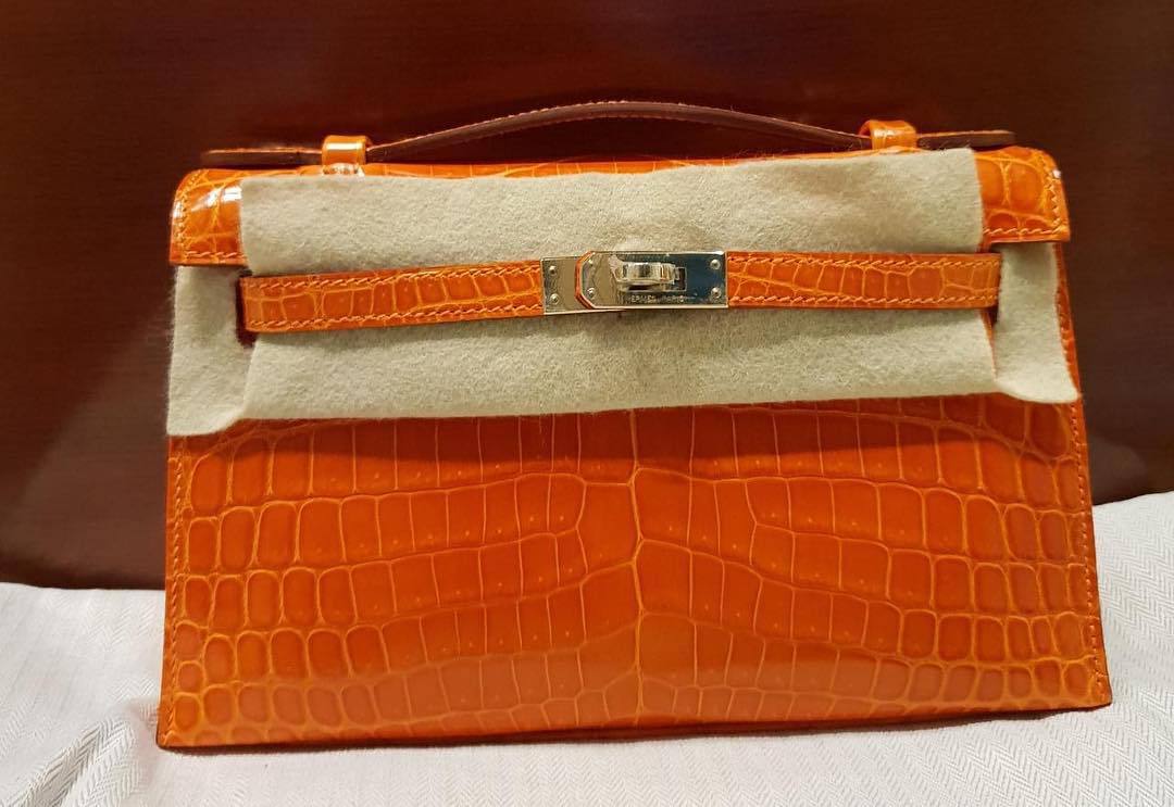 Hermes Kelly Pochette Orange Porosus Lisse Shiny Palladium Hardware #R -  Vendome Monte Carlo